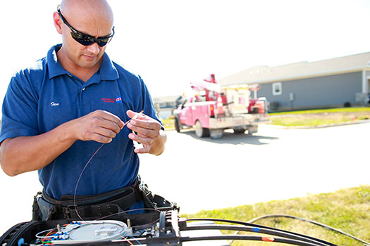 CFU Tech splicing fiber in residential neighborhood