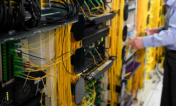 CFU communications tech pulling fiber in residential neighborhood