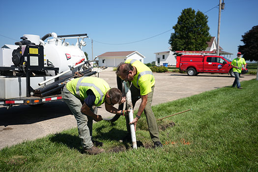 CFU communications crew installing fiber into ground